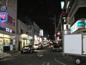 One of the narrow, tightly parked city streets.