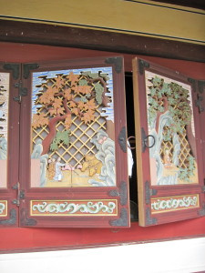 All of the temple windows had carved shutters like this one, each depicting a scene from the life of Buddha.