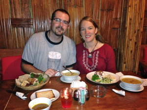The end of a long full day - delicious dinner of tofu curry (Beth) and suckling pig (Patrick) overlooking a rice paddy.